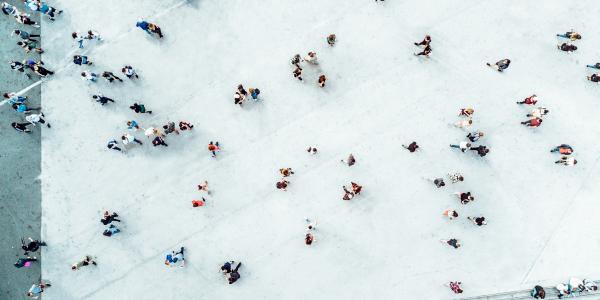 Birds eye view of people on blue floor