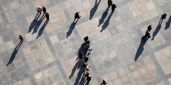 people walking across street