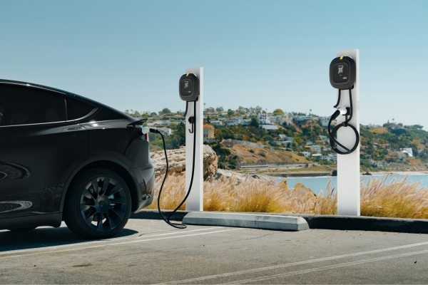 Tesla plugged into a charger