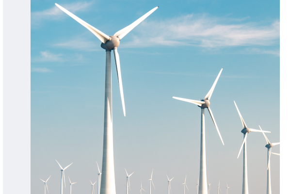 wind turbines on green grassland