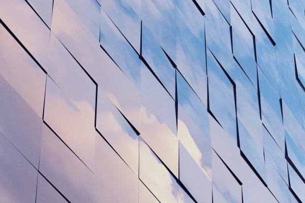 clouds reflecting on building