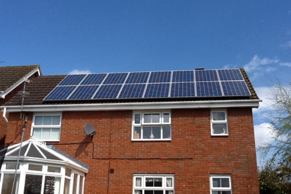 Image of solar panels on a red brick home