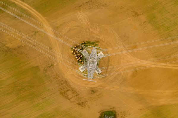 Aerial view of transmission tower in the desert