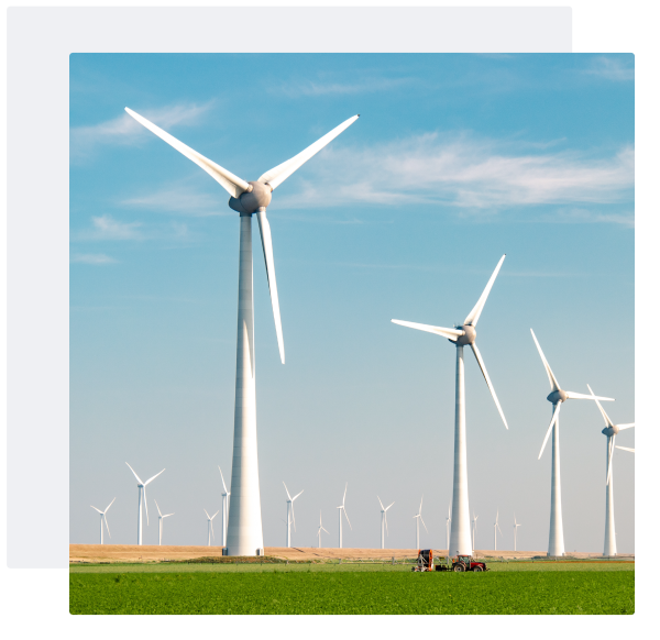 wind turbines on green grassland