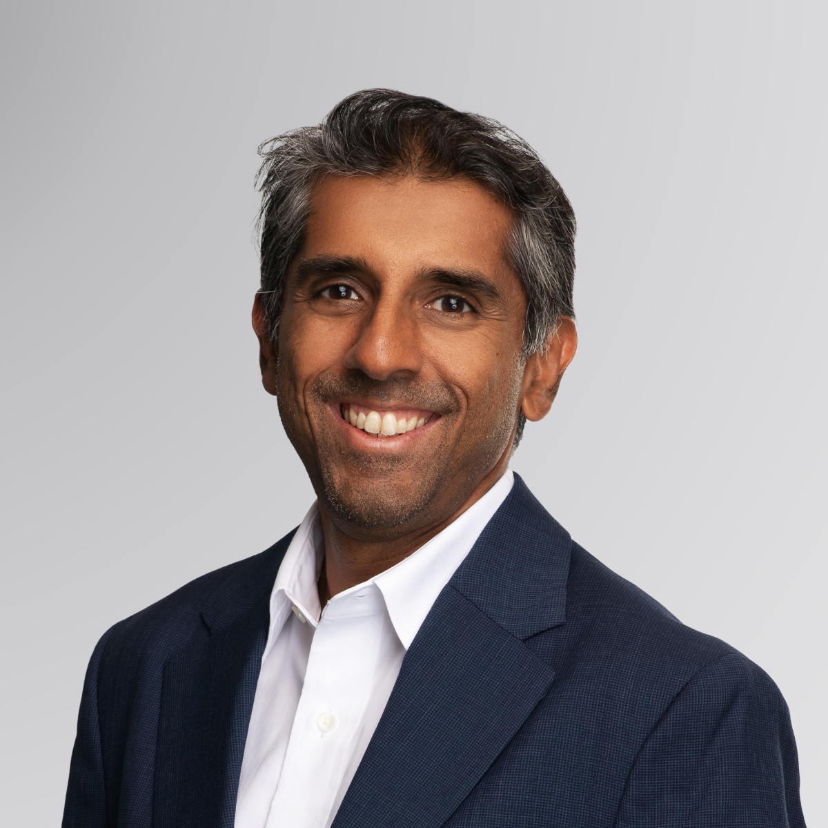 Headshot of Vishal Shah in a navy blue suit