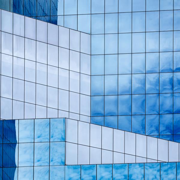 Geometric windowed building with blue tints
