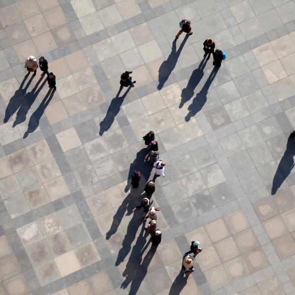 people walking across street